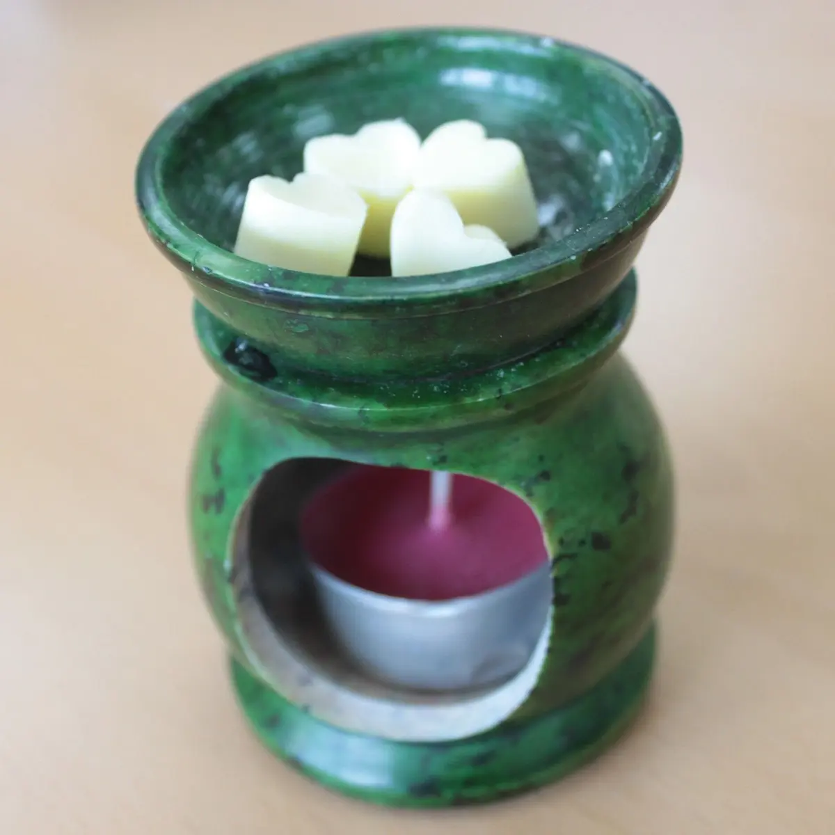 Glass jar of soy wax heart melts