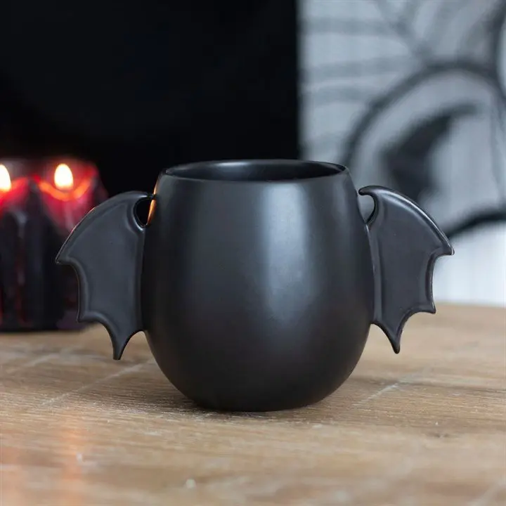 Black mug with bat wing handles