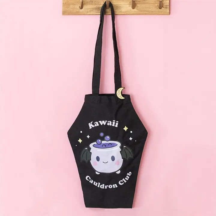 Coffin-shaped tote bag with a cauldron design