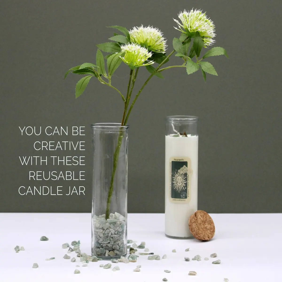 Magic spell candle with gemstones in the wax