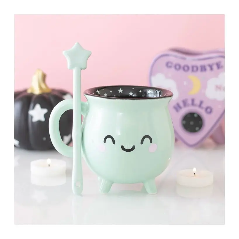 Mint green cauldron mug with a wand