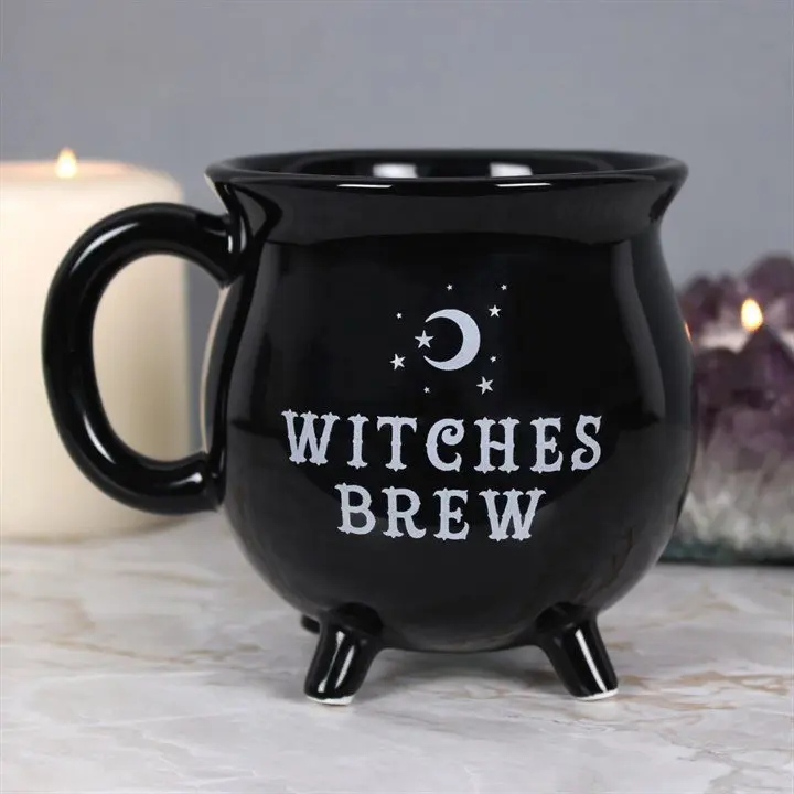 Black cauldron-shaped mug with the words Witches Brew